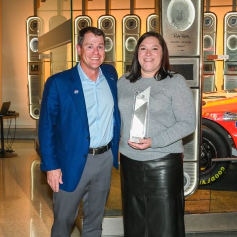 Kevin Camper (left) presents the Client Services Award to Jill Frischmann